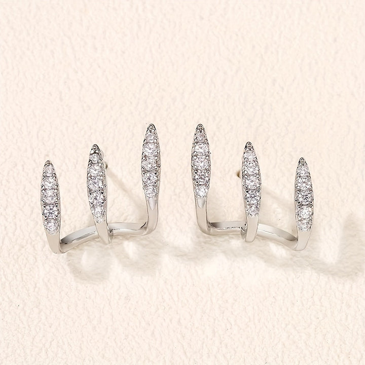 Elegantne naušnice sa tri kandže ukrašene draguljima